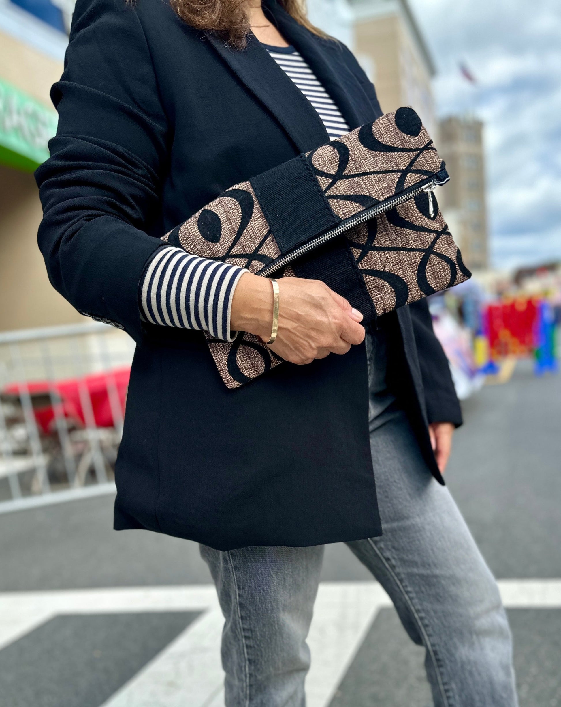 Foldover Clutch with tabs for strap.
