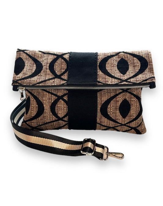 Versatile foldover clutch with detachable strap.