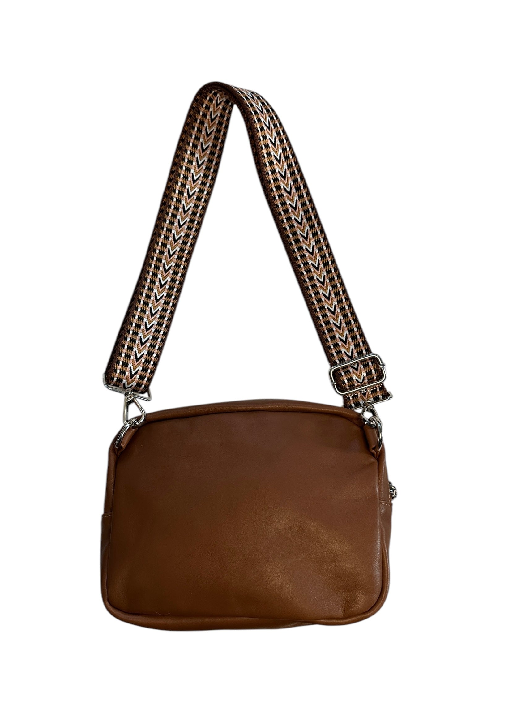 Leather and fabric sling bag with colorful web.