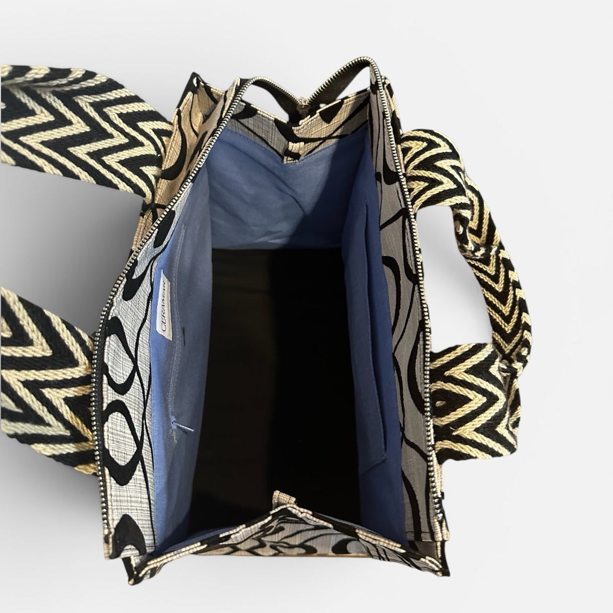 Open bag with geometric pattern on a white background