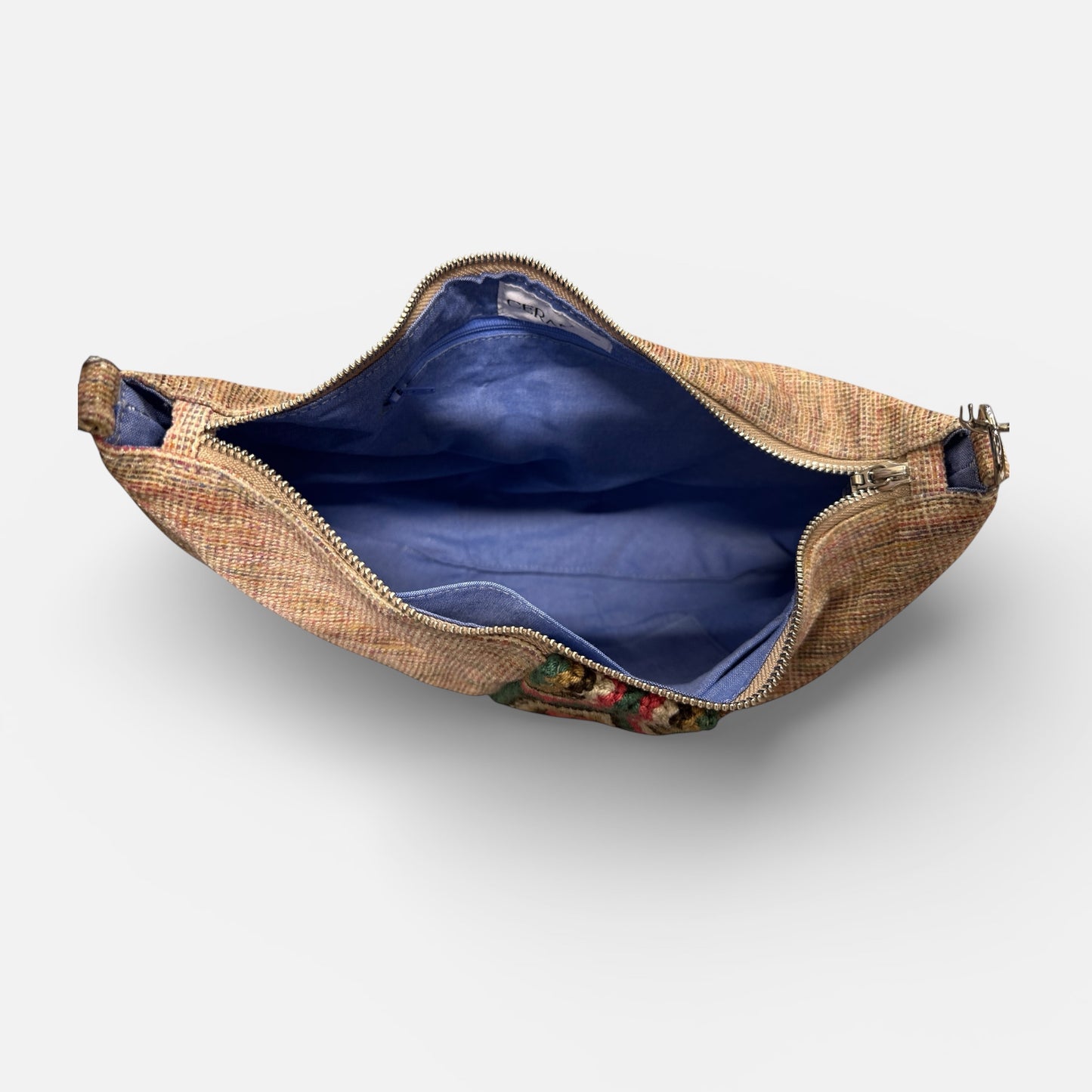 Open woven bag with floral pattern on a white background