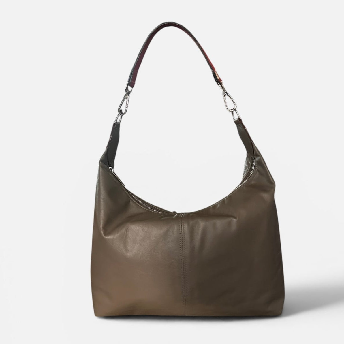 Medium taupe leather slouchy shoulder bag featuring a contrasting red leather shoulder strap, soft silhouette, and spacious interior for everyday wear.
