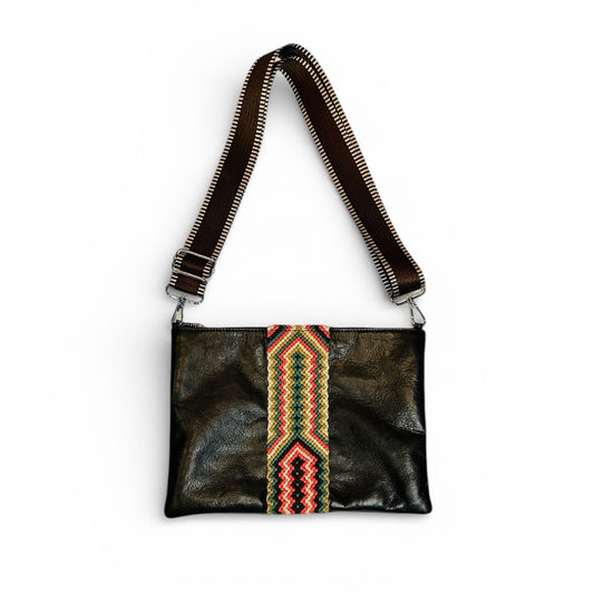 Black leather crossbody bag with colorful geometric pattern on a white background