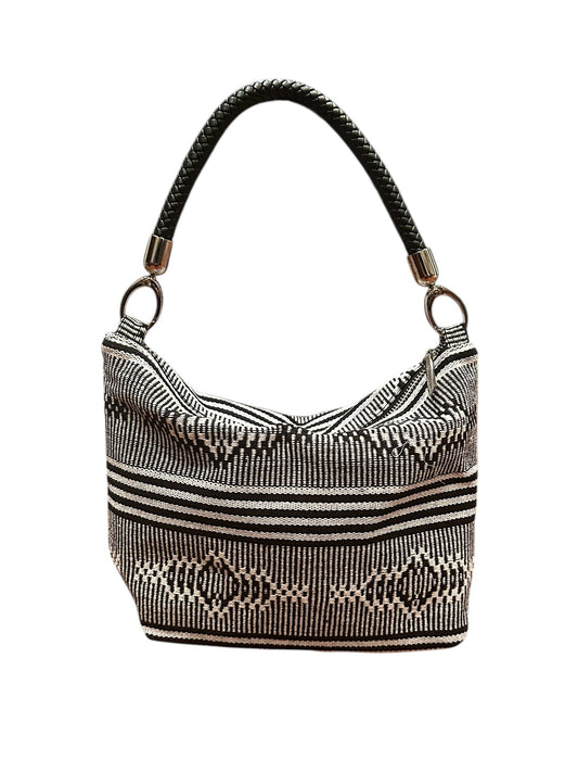 Handbag with a woven pattern on a white background