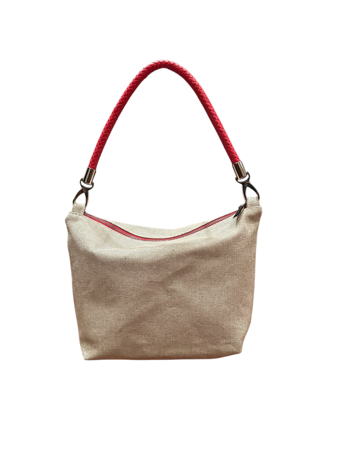 Beige handbag with red handle on a white background
