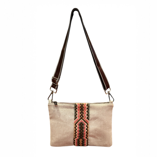 Beige crossbody bag with a colorful pattern on a white background
