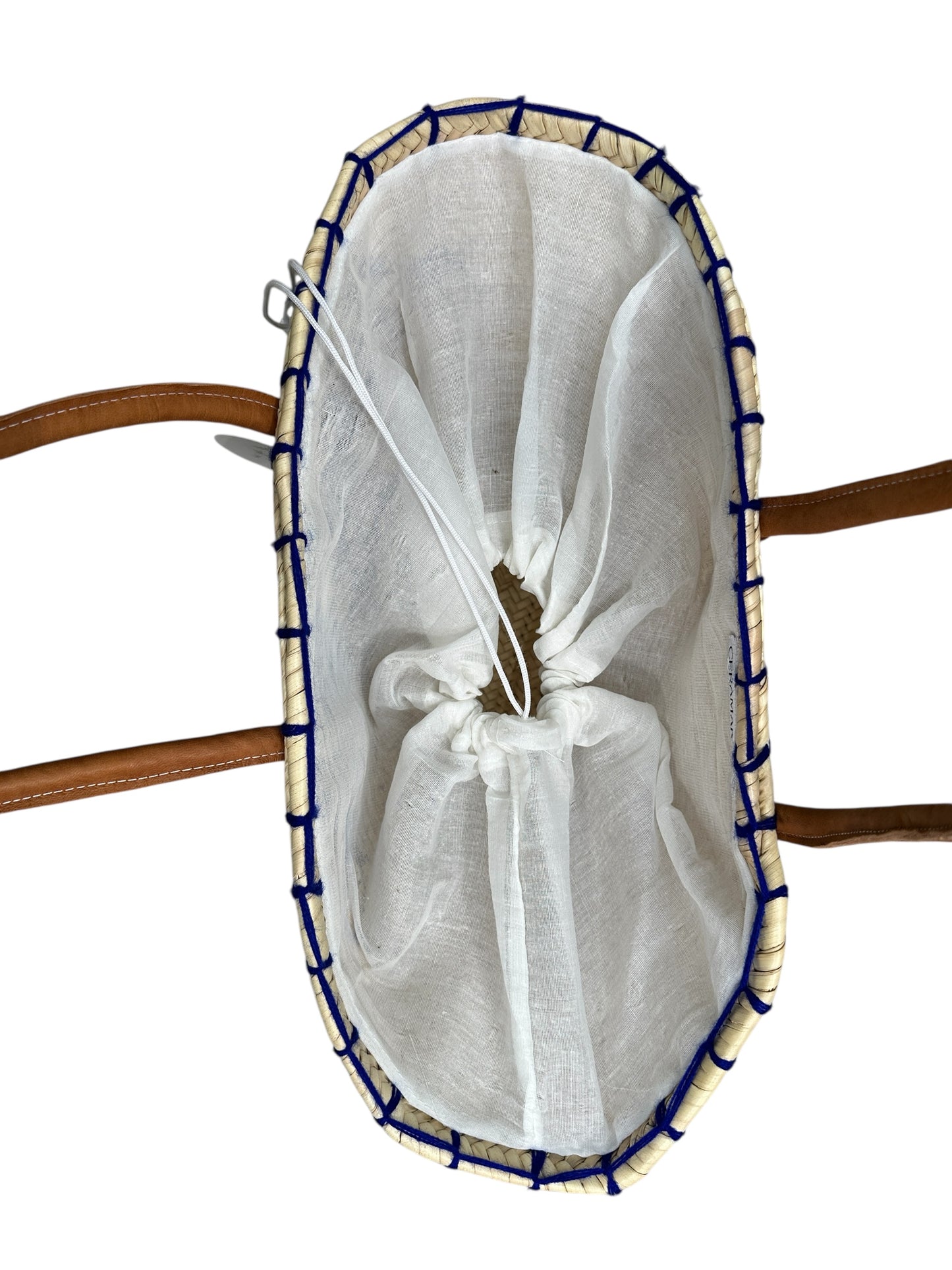 White mesh bag with blue trim on a wooden surface