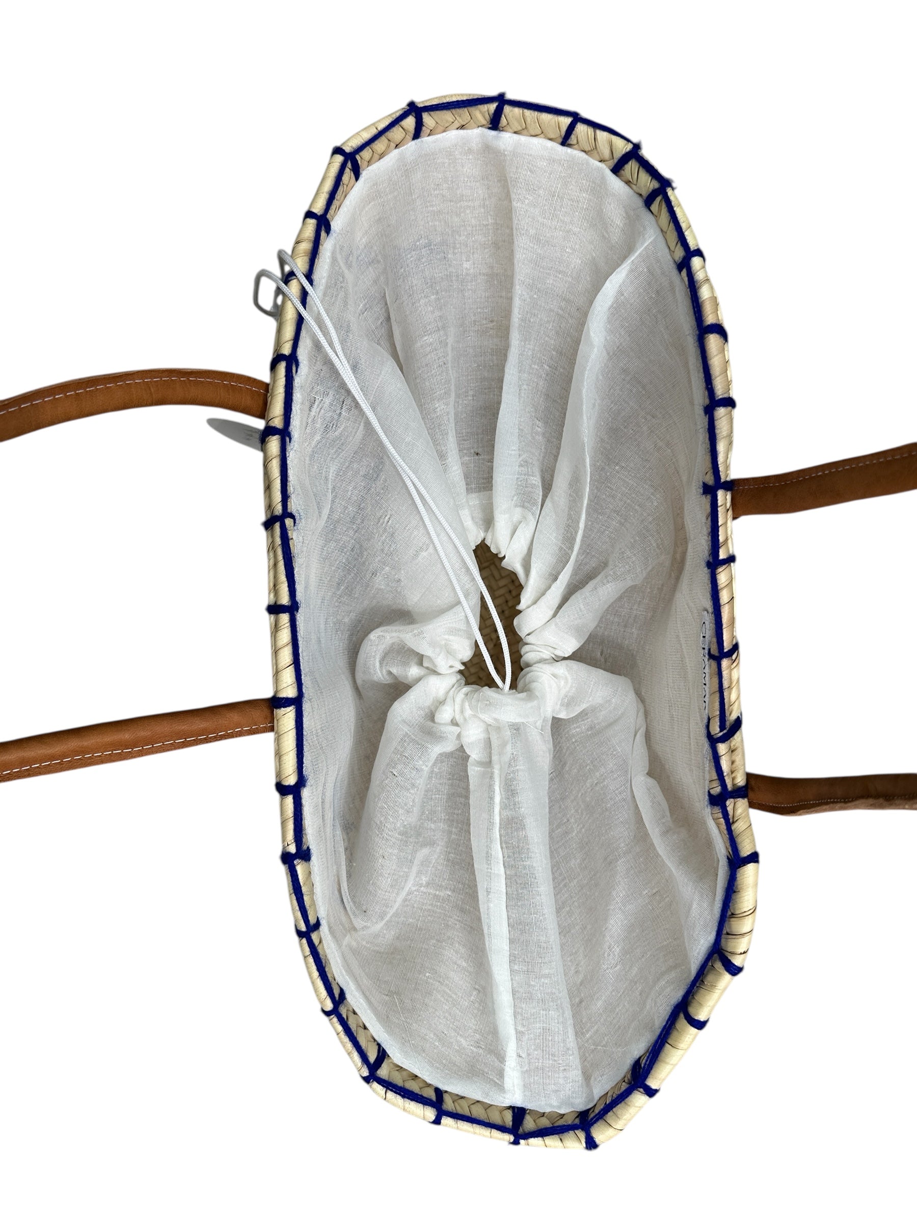 White mesh bag with blue trim on a wooden surface