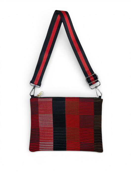 Red and black striped bag with a strap on a white background