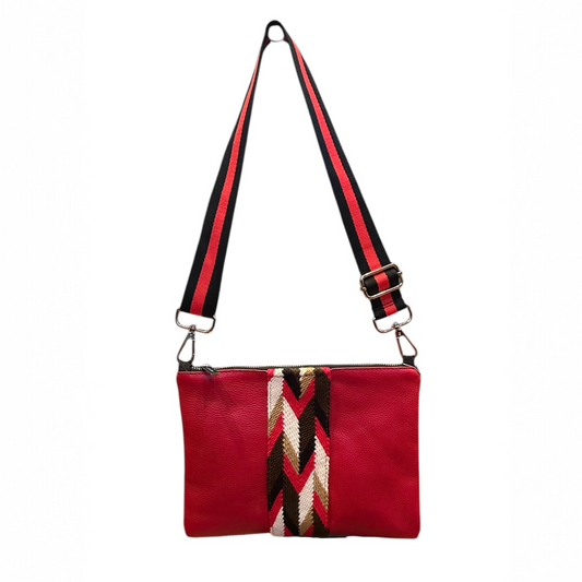 Red handbag with a patterned strap on a white background