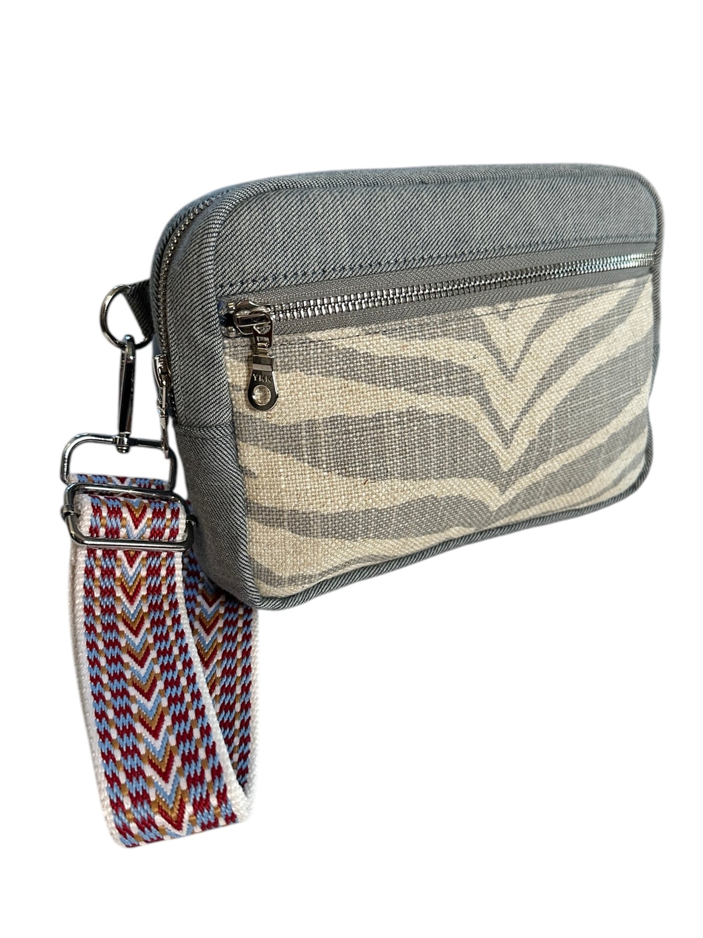 Unisex zebra print denim sling crossbody travel bag, the essential bag for your adventures.
