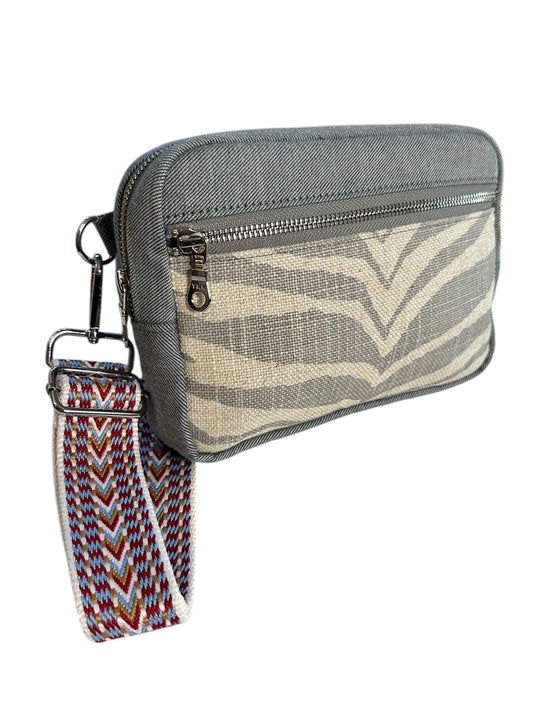 Unisex zebra print denim sling crossbody travel bag, the essential bag for your adventures.