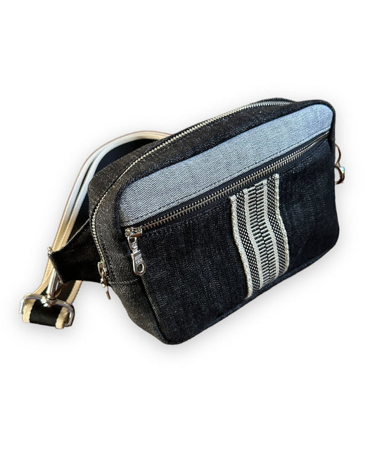 Unisex black denim sling crossbody bag with black & cream webbing.