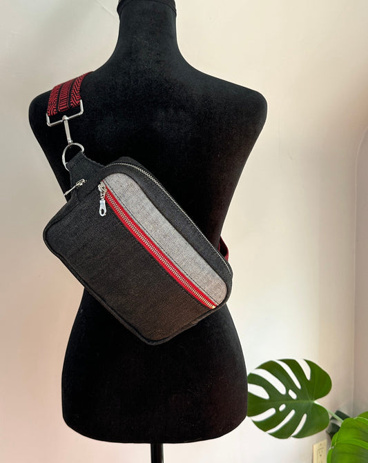 Unisex Crossbody Sling Bag- Black denim bag with Red and Black guitar Strap webbing.