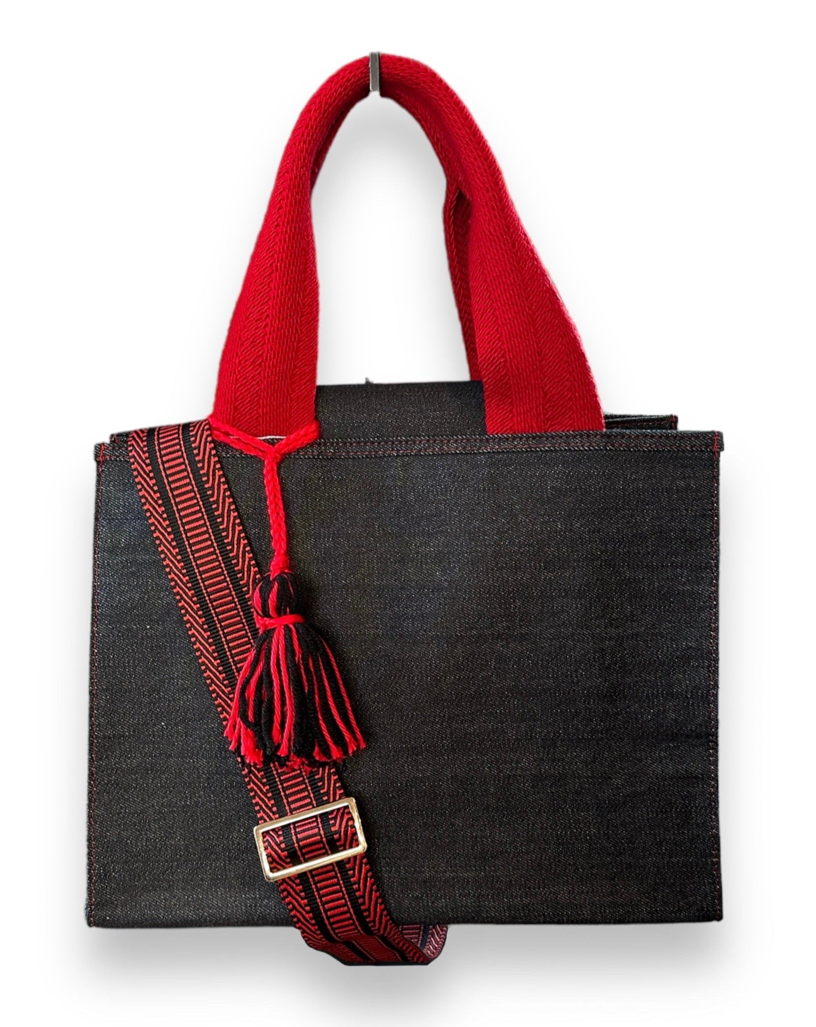 Black denim tote with detachable crossbody strap. 