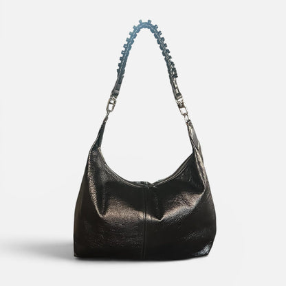Medium black crinkle leather slouchy shoulder bag featuring a black braided leather shoulder strap, relaxed silhouette, and spacious interior for everyday style.