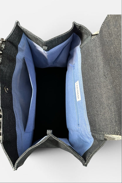 Gray denim wallet with blue interior on a white background