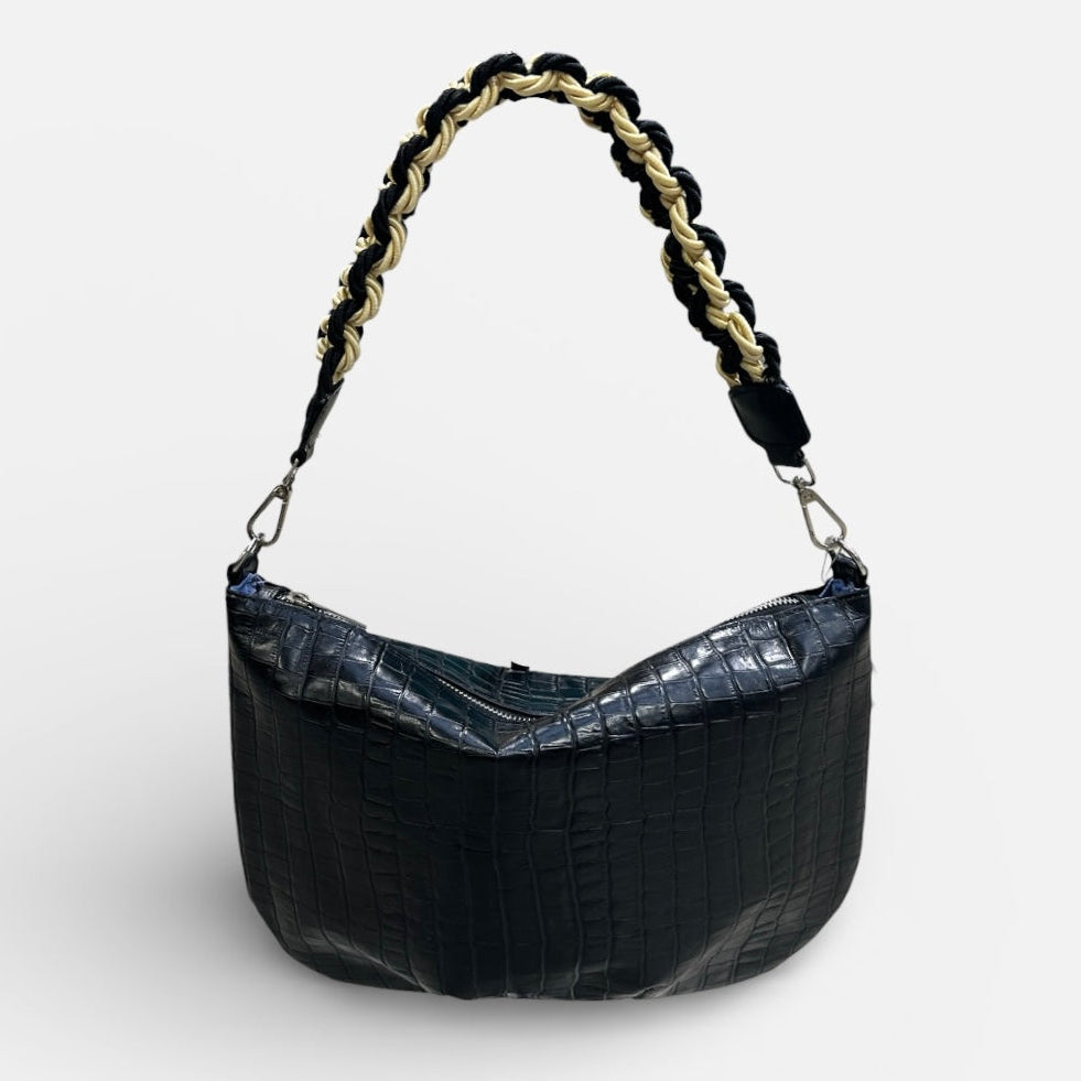 Black handbag with braided handle on a white background