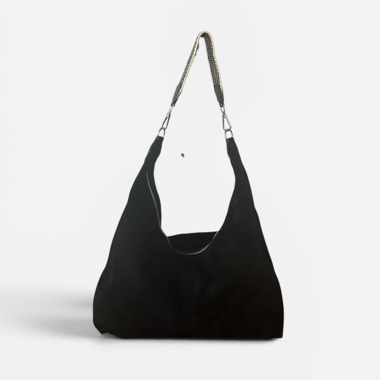 Large black suede slouchy shoulder bag featuring a handwoven Wayuu strap, spacious interior, and artisan craftsmanship for work, travel, and everyday style.