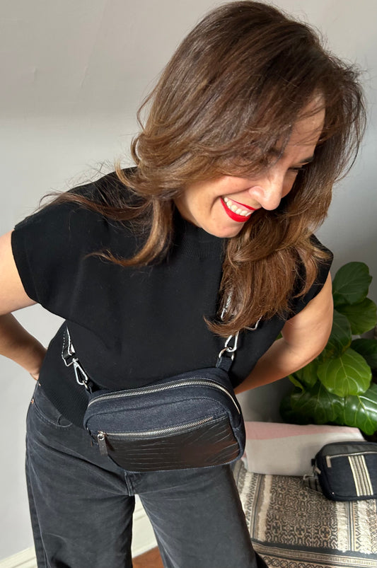 Black denim and croco leather sling bag.