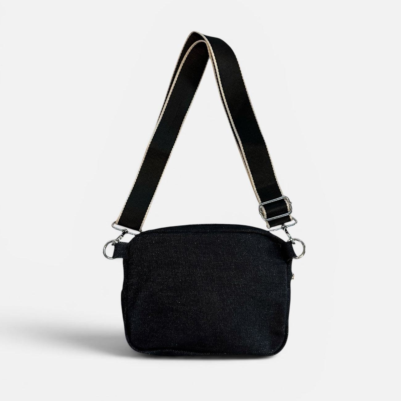 Black shoulder bag on a light gray background