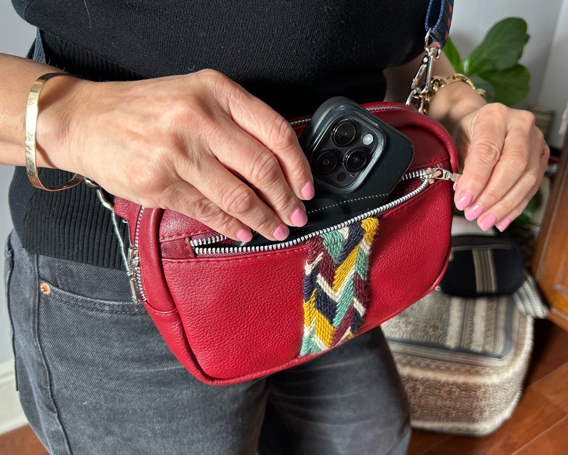 Burgundy leather multi colored crossbody sling bag.