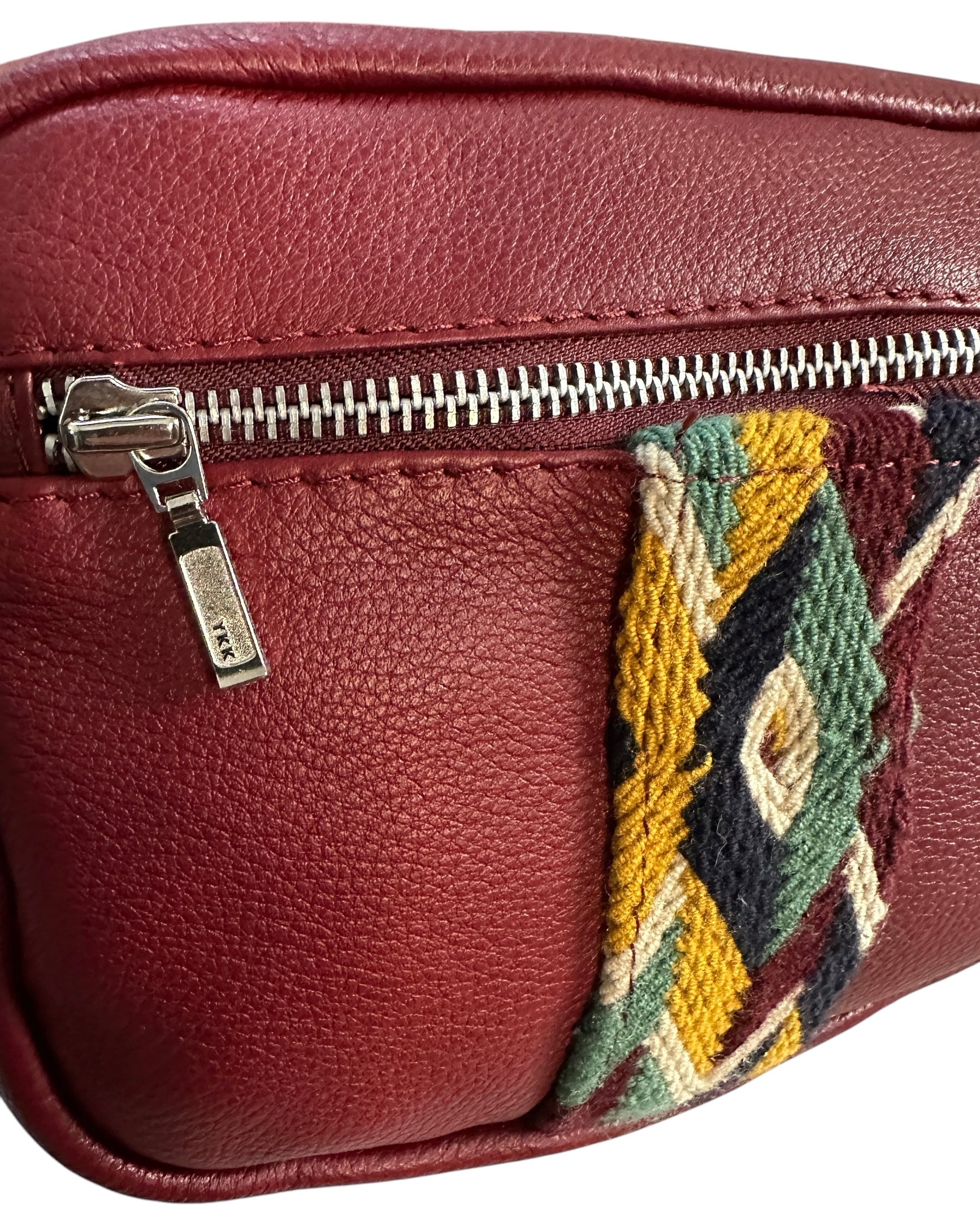 Burgundy leather multi colored crossbody sling bag.