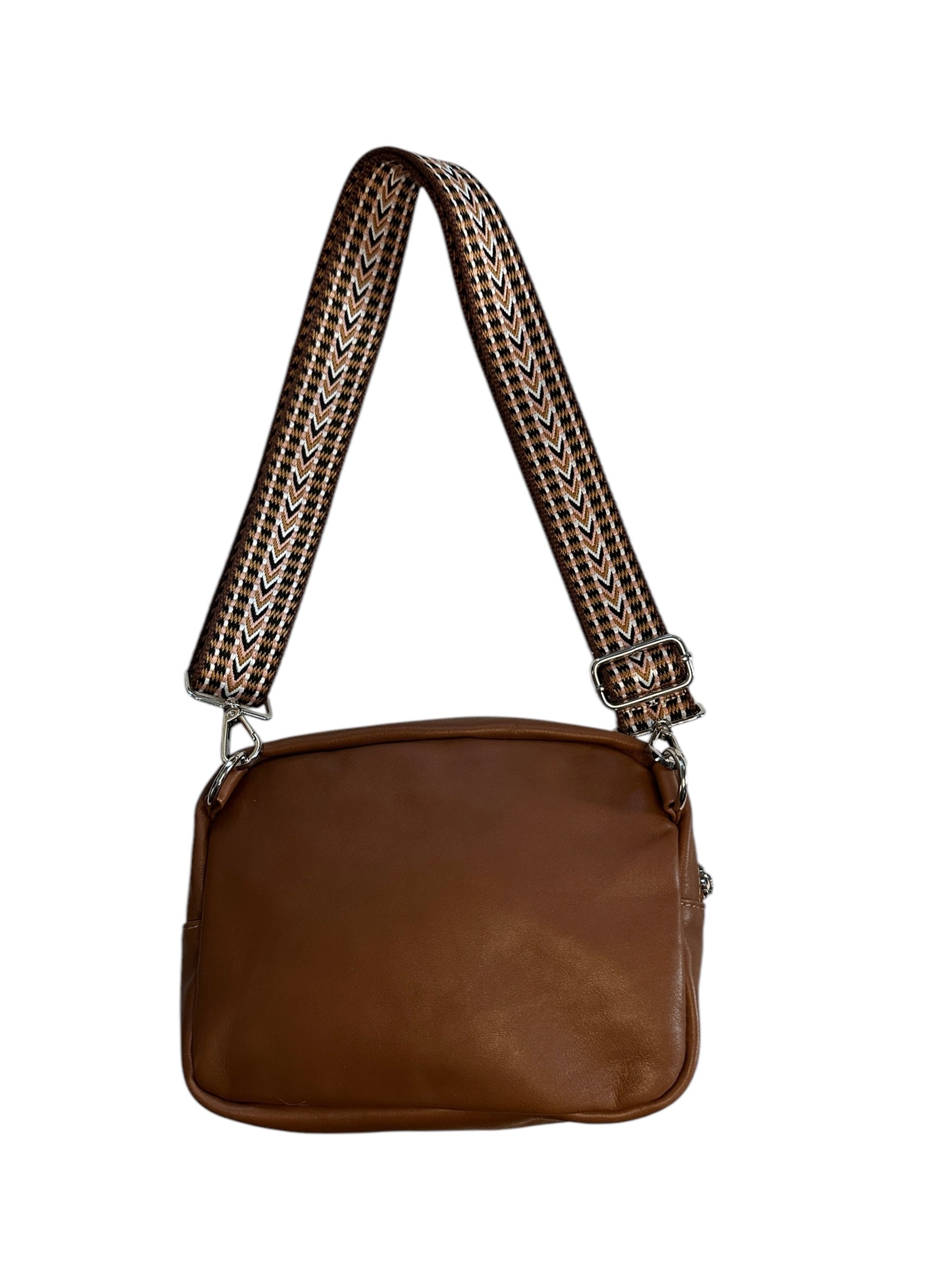 Leather and fabric sling bag with colorful web. 