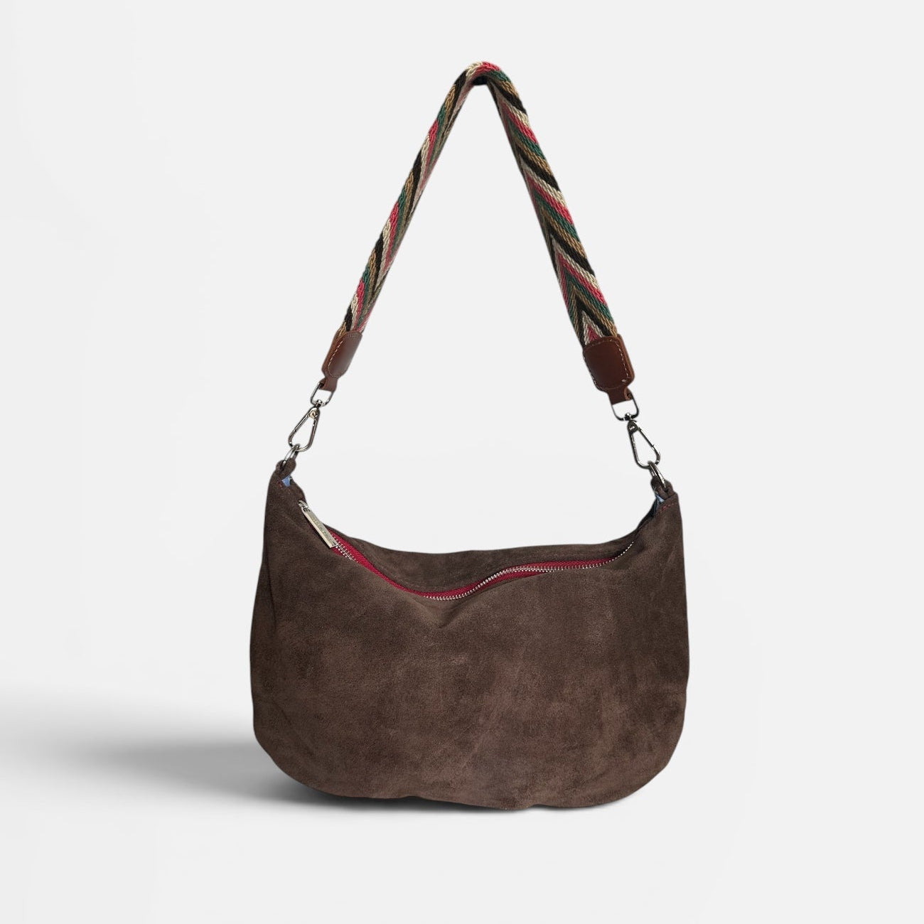 Chocolate suede hobo shoulder bag featuring a handwoven Wayuu strap with leather trim, a soft slouchy silhouette, and a spacious interior for everyday use.
