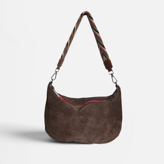 Chocolate suede hobo shoulder bag featuring a handwoven Wayuu strap with leather trim, a soft slouchy silhouette, and a spacious interior for everyday use.
