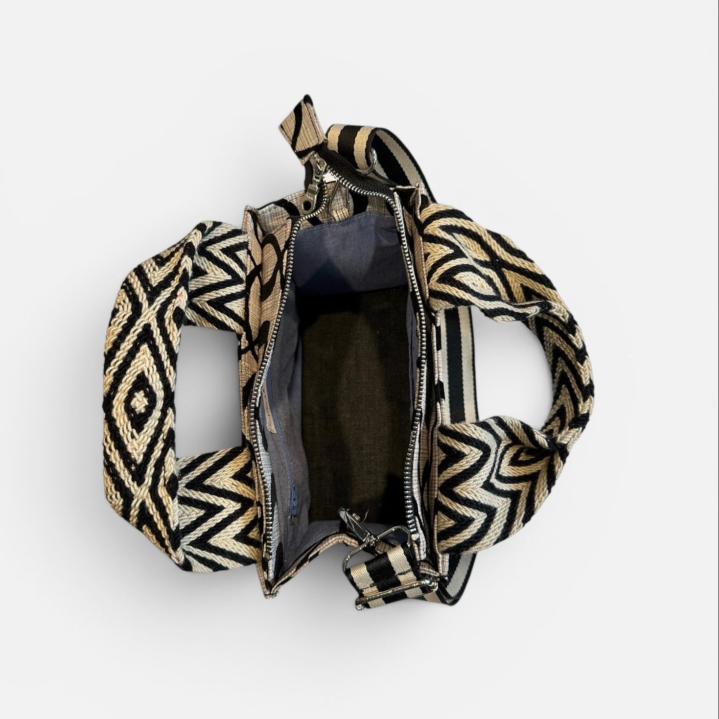 Patterned handbag with open front on a white background