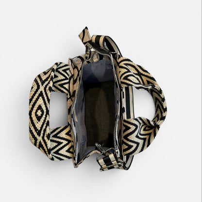Patterned handbag with open front on a white background