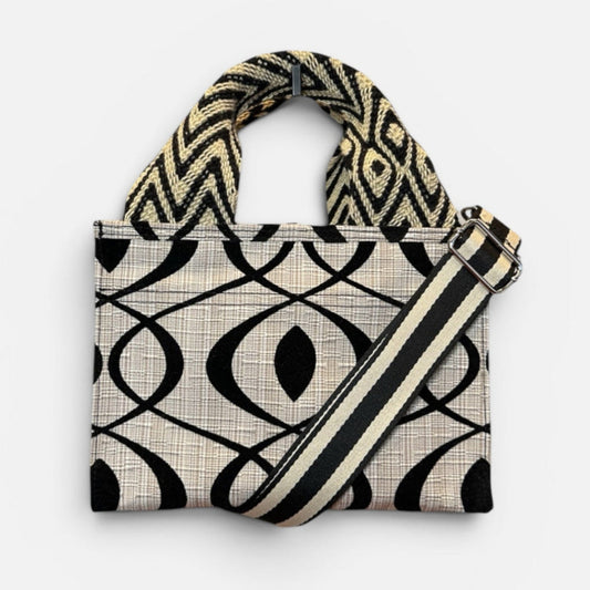 Handbag with geometric pattern on a white background