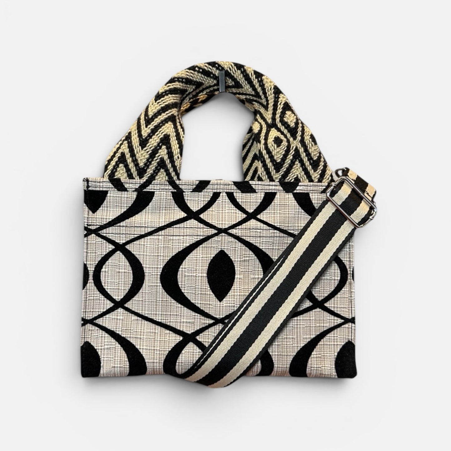 Handbag with geometric pattern on a white background