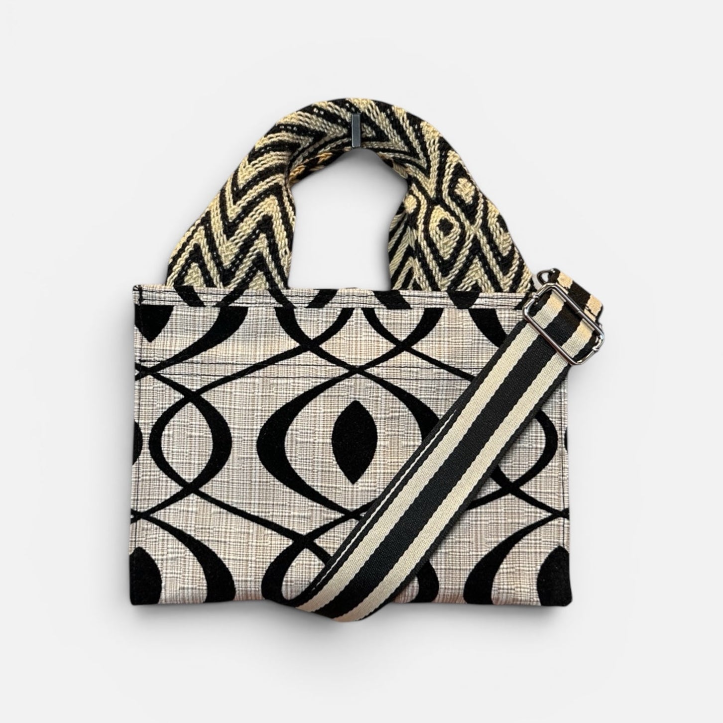 Handbag with geometric pattern on a white background