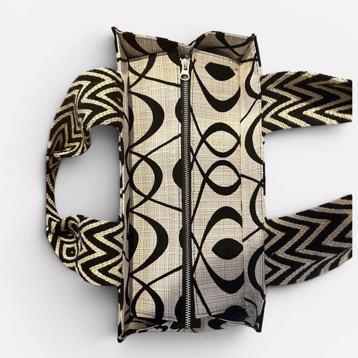 Patterned bag with a zipper on a white background