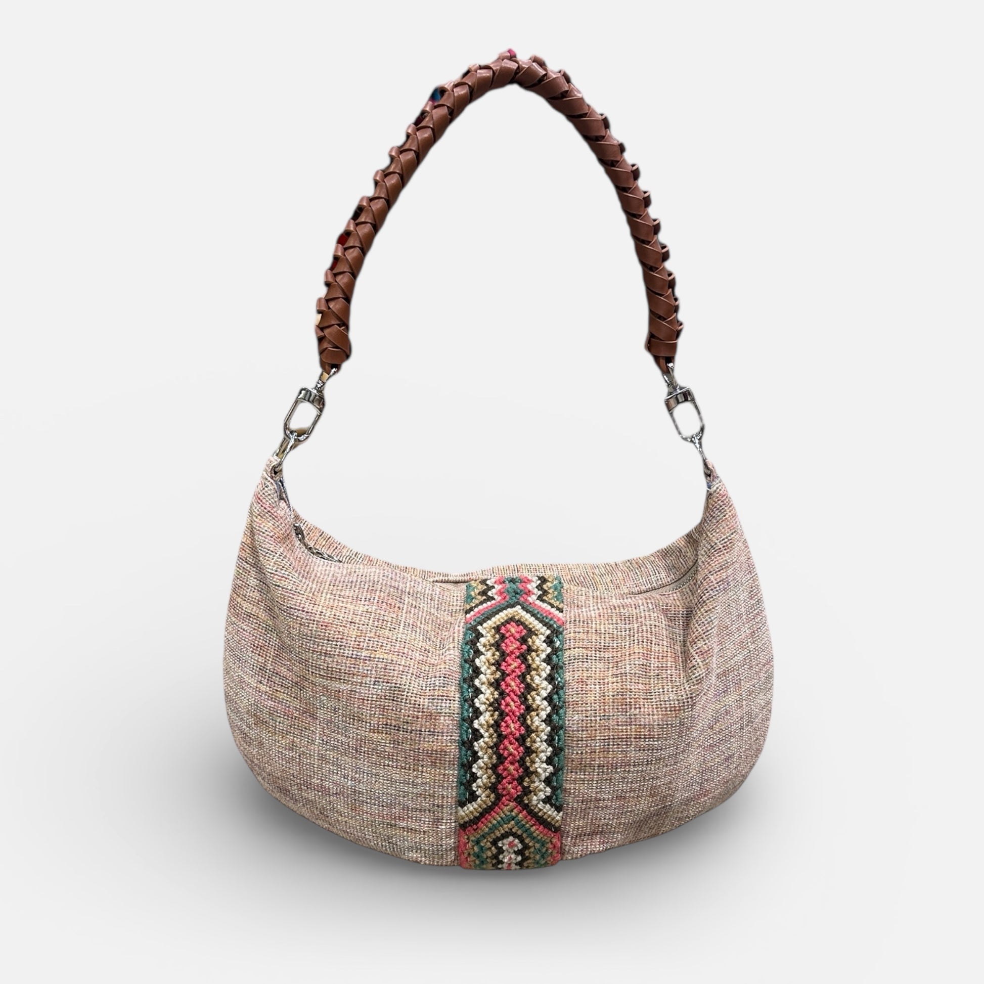 Textured handbag with a braided handle on a white background