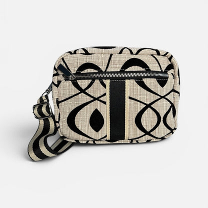 Patterned bag with a strap on a white background