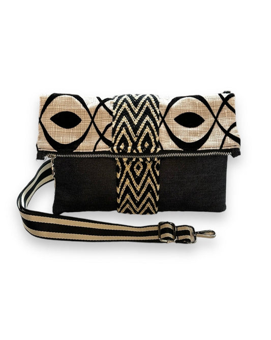Foldover crossbody with a removable strap to wear as a clutch. 