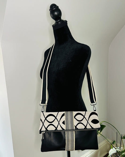 Cream Swirl and black leather foldover crossbody bag. 