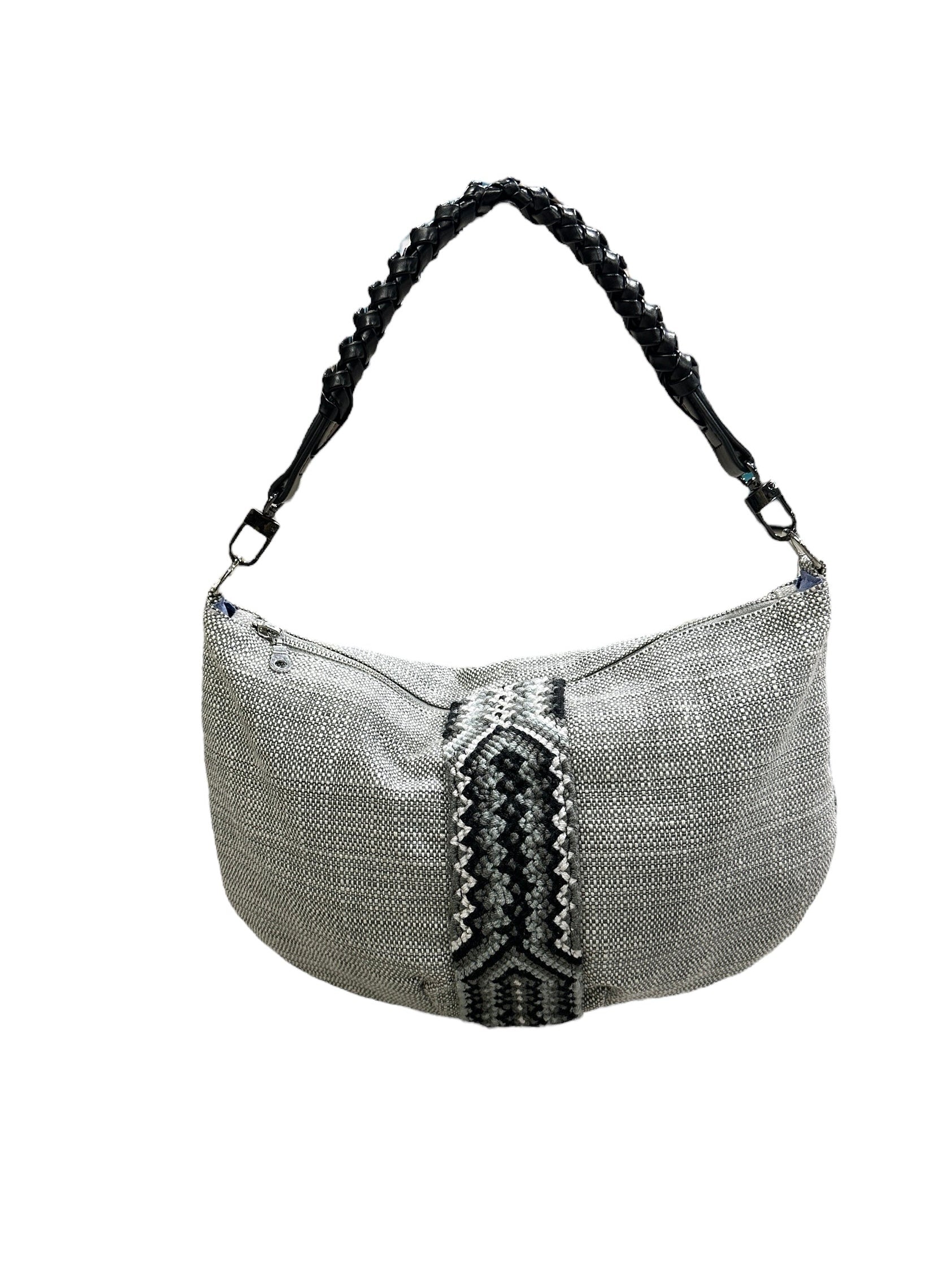 Textured handbag with braided handle on a white background