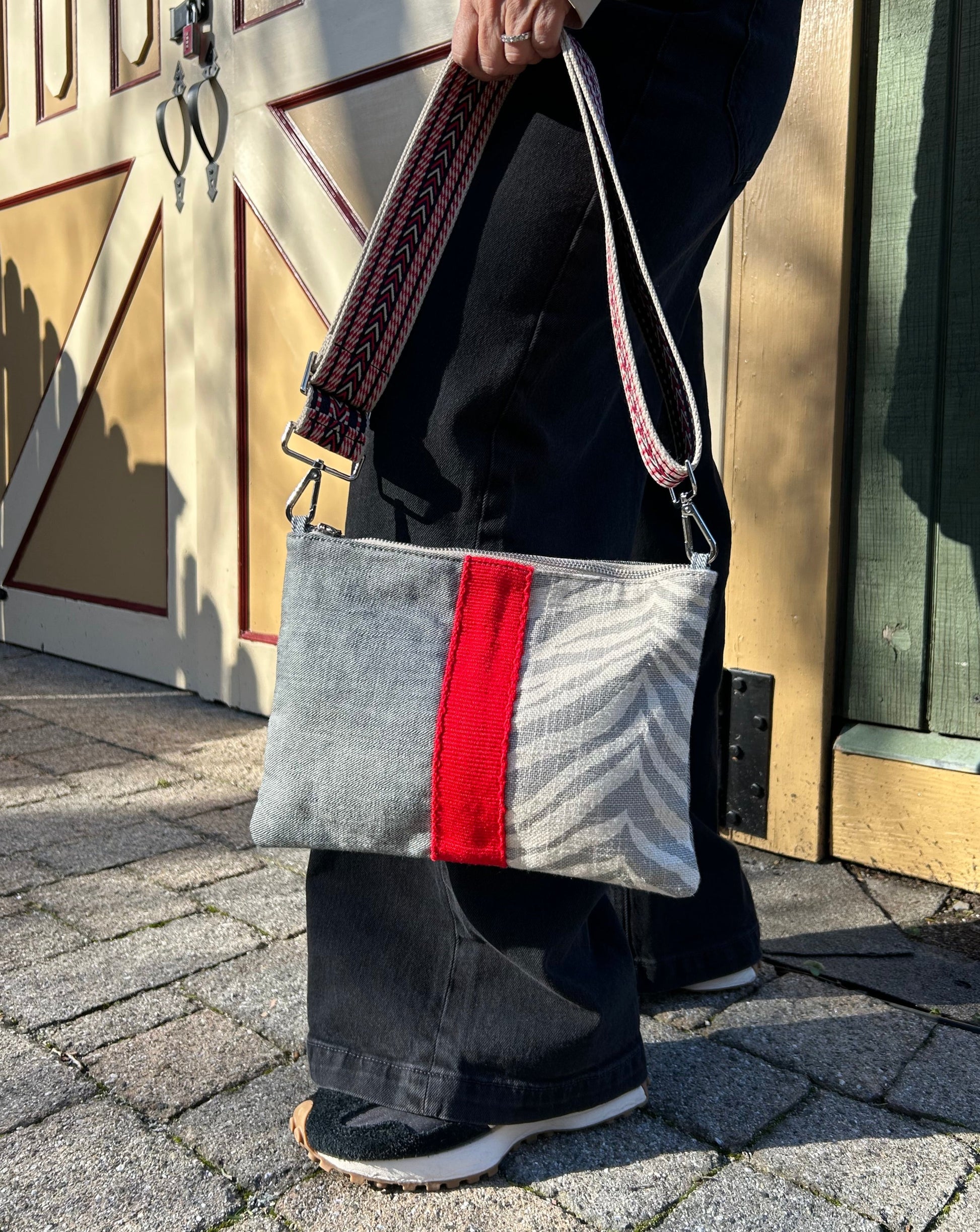 Mina Crossbody bag- Gray and Cream Zebra print and Denim bag with Multi color guitar strap webbing.