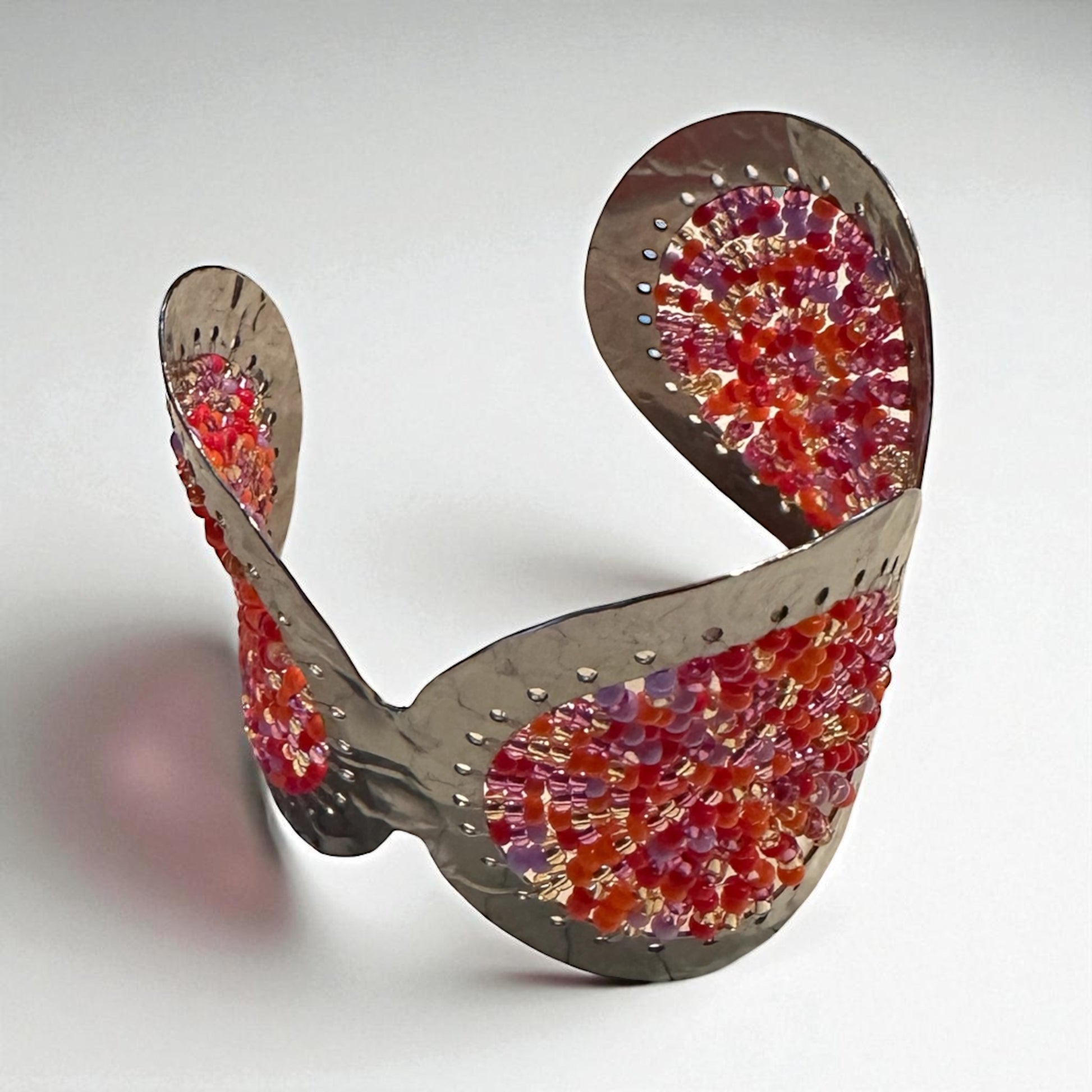 3/4 view orange and pink handmade bracelet cuff