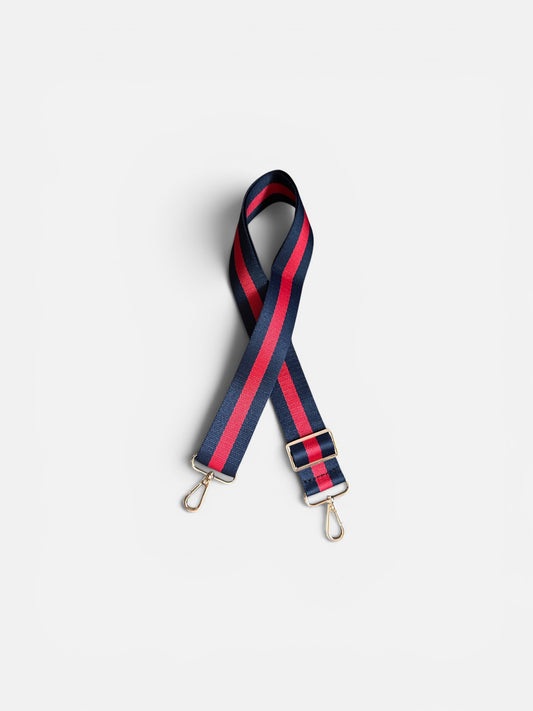 Striped bag strap with red and blue pattern on a white background