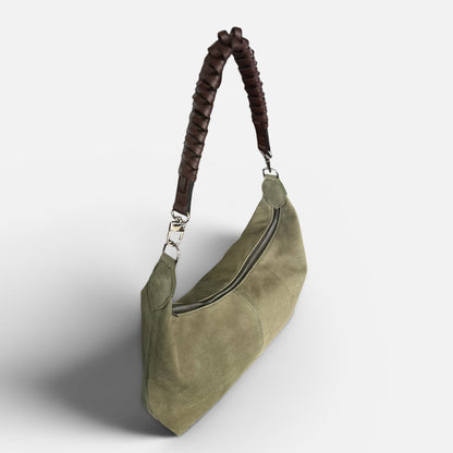Medium olive suede slouchy shoulder bag featuring a braided leather shoulder strap, soft silhouette, and spacious interior for everyday style.