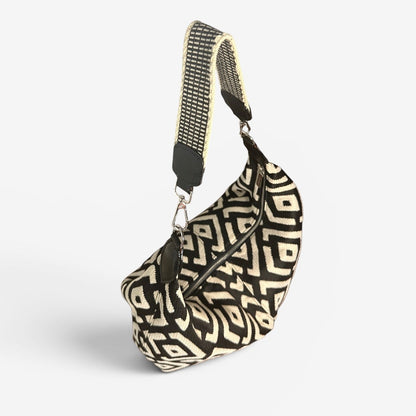 Large black and cream geometric fabric slouchy shoulder bag featuring a handwoven Wayuu strap, spacious interior, and artisanal Colombian-inspired details.
