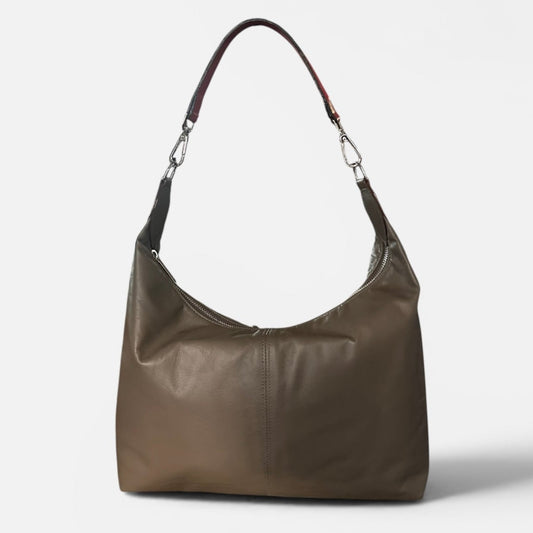 Medium taupe leather slouchy shoulder bag featuring a contrasting red leather shoulder strap, soft silhouette, and spacious interior for everyday wear.