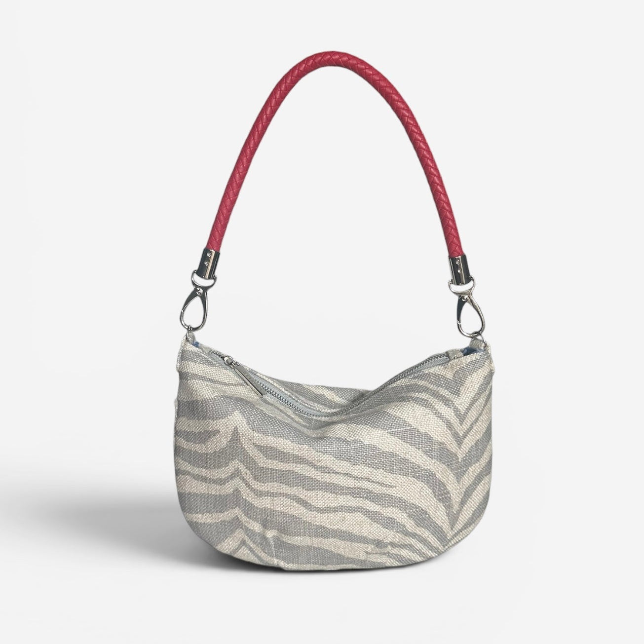 Mini zebra fabric hobo shoulder bag featuring a red braided shoulder strap, compact silhouette, and artisan-inspired design for everyday essentials.