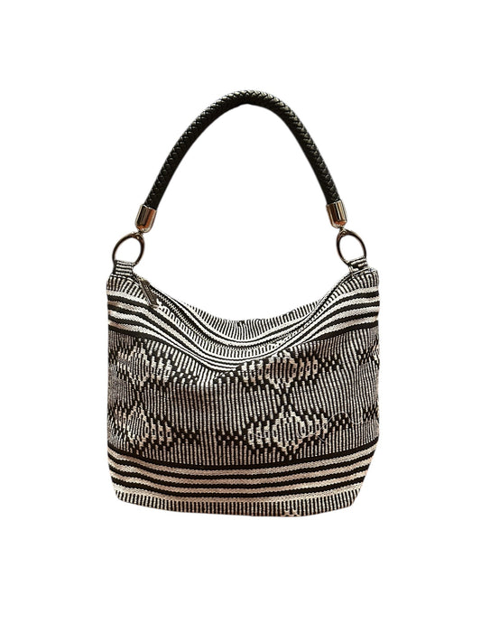 Textured handbag with a pattern on a white background