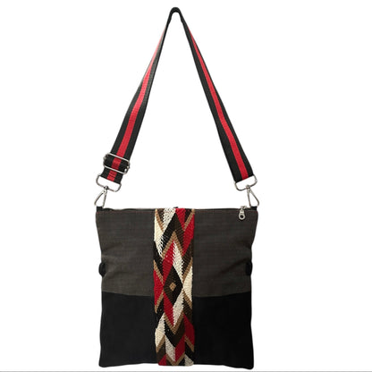 Modern black faux suede crossbody bag featuring pinstripe detail
